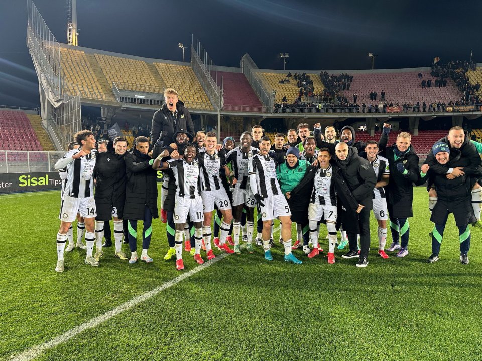 Udinese Calcio team celebrating on the field.