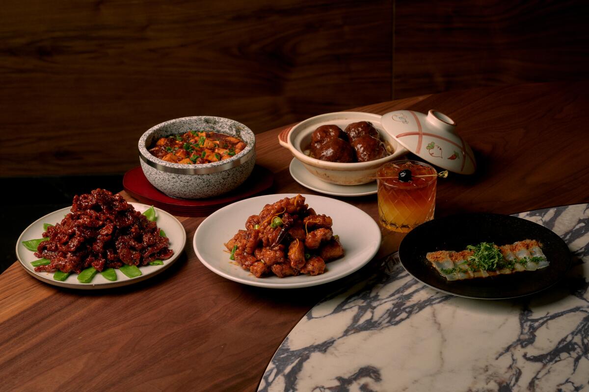 Food dishes and drinks on a table.