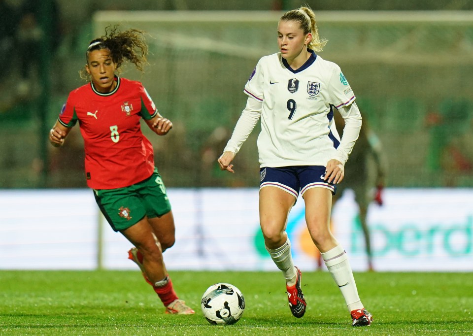 Alessia Russo of England and Andreia Norton of Portugal playing soccer.