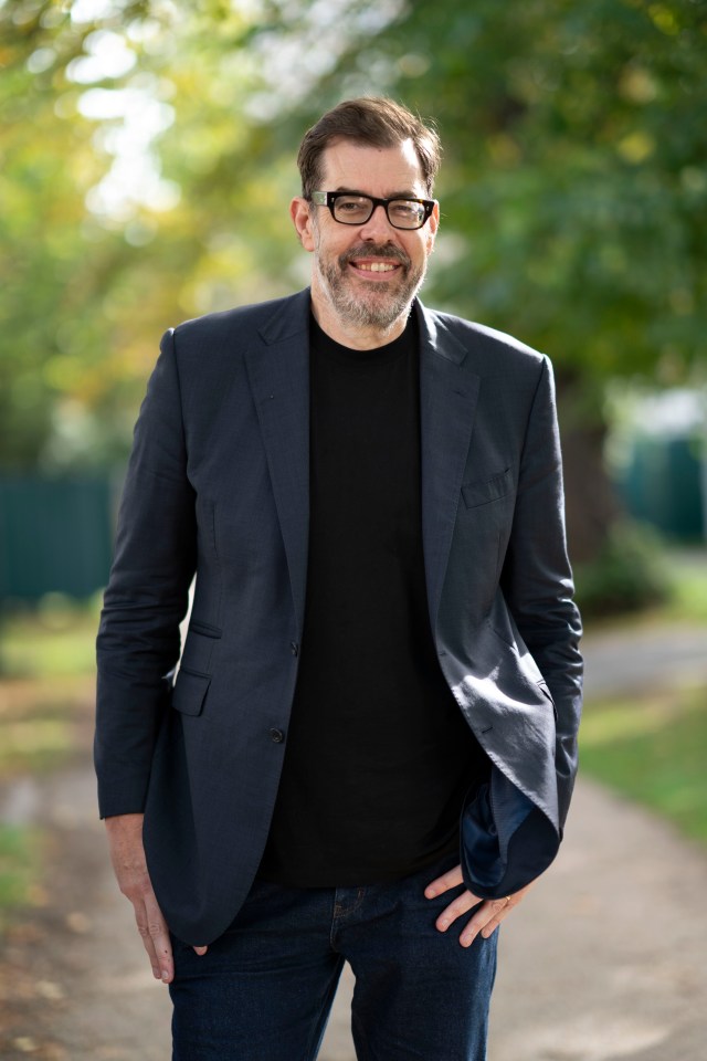 Richard Osman, best-selling author and television personality, smiling.