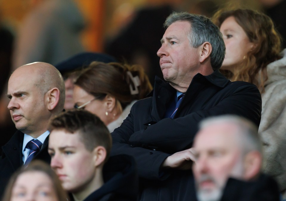 Rangers CEO Patrick Stewart sitting with arms crossed.