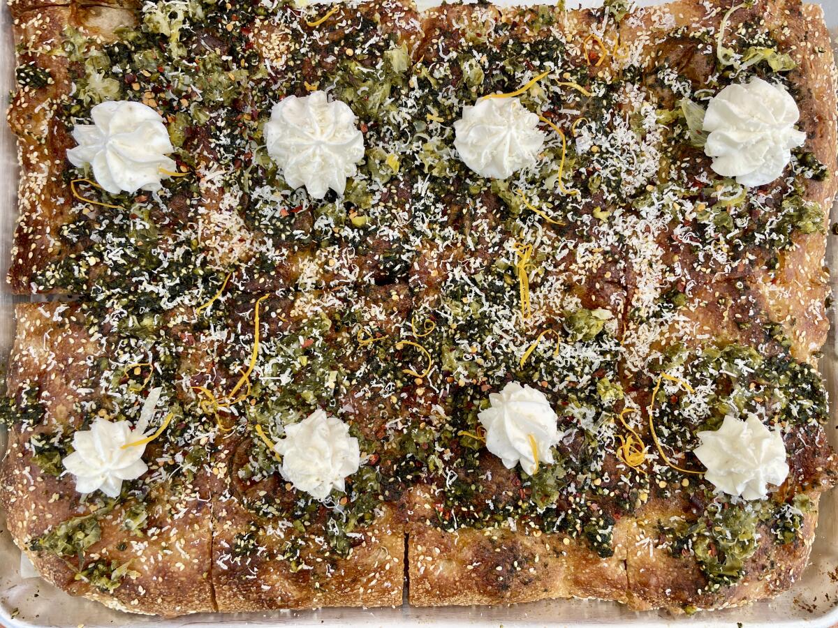 Focaccia with arugula pesto and ricotta.