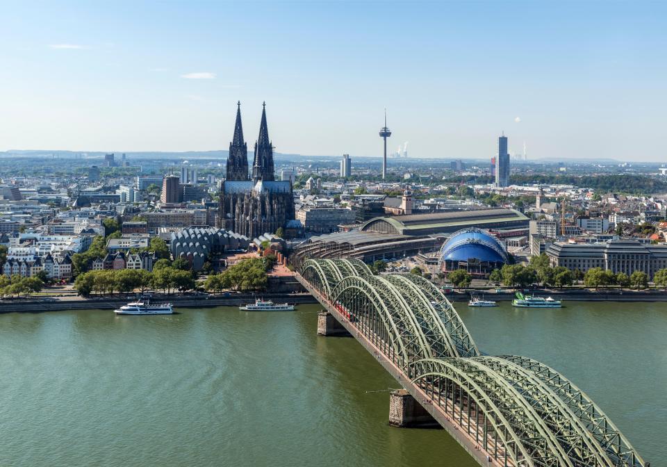 Aerial view of Cologne Cathedral, Hohenzollern Bridge, and Cologne Central Station.