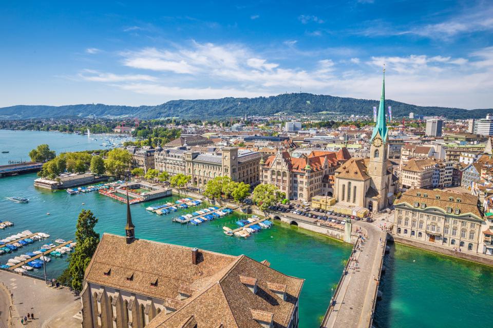 Aerial view of Zurich, Switzerland, featuring the Fraumünster Church and Limmat River.