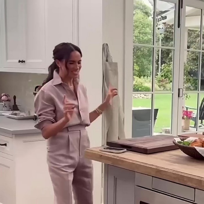 Meghan Markle in a kitchen, celebrating her Netflix show launch.