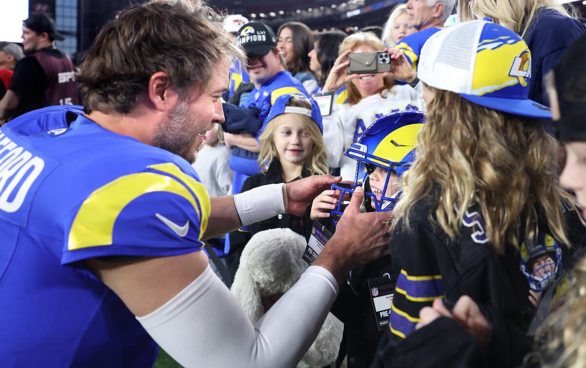 Rams quarterback Matthew Stafford spends time with his daughters before facing the Minnesota Vikings in the playoffs.