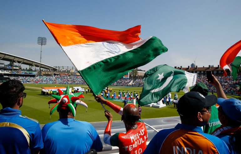 Britain Cricket - Pakistan v India - 2017 ICC Champions Trophy Final - The Oval - June 18, 2017 India and Pakistan fans wave flags as the players walk out before the match Action Images via Reuters / Paul Childs Livepic EDITORIAL USE ONLY.