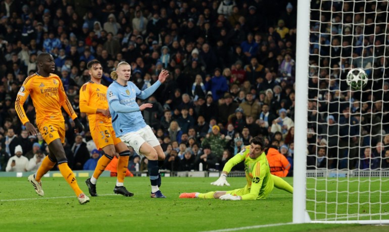 Soccer Football - Champions League - Knockout Phase Playoff - First Leg - Manchester City v Real Madrid - Etihad Stadium, Manchester, Britain - February 11, 2025 Manchester City's Erling Haaland scores their first goal REUTERS/Phil Noble