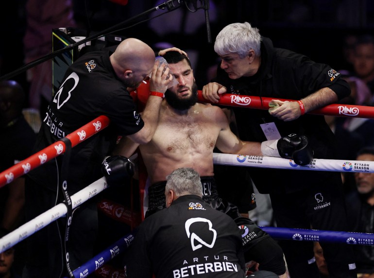 Boxing - Light Heavy Championship - Artur Beterbiev v Dmitrii Bivol - anb Arena, Riyadh, Saudi Arabia - February 23, 2025 Artur Beterbiev with his team during his fight with Dmitrii Bivol REUTERS/Hamad I Mohammed