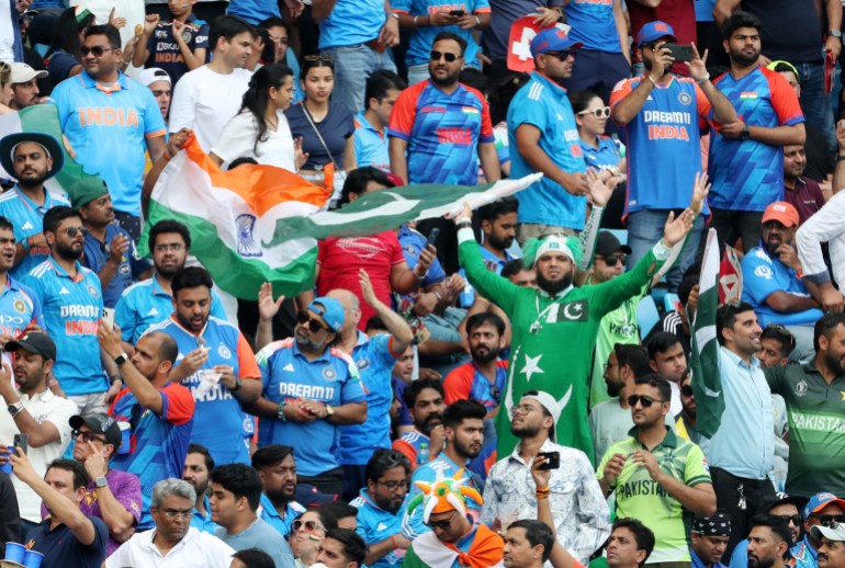 Cricket - ICC Men's Champions Trophy - Group A - India v Pakistan - Dubai International Stadium, Dubai, United Arab Emirates - February 23, 2025 India and Pakistan fans react in the stands REUTERS/Satish Kumar