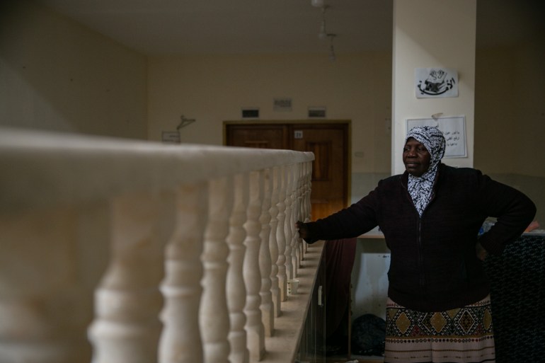 Halima Zawahidi overlooking a bannister