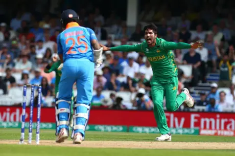 Getty Images Muhammad Amir of Pakistan celebrate the wicket of Shikhar Dhawan of India during the ICC Champions Trophy Final match between India and Pakistan at The Oval in London on June 18, 2017