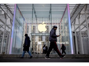 The Apple Fifth Avenue store in New York, US, on Monday, Feb. 24, 2025. Apple Inc., as it seeks relief from US President Donald Trump's tariffs on goods imported from China, said that it will hire 20,000 new workers and produce AI servers in the US.