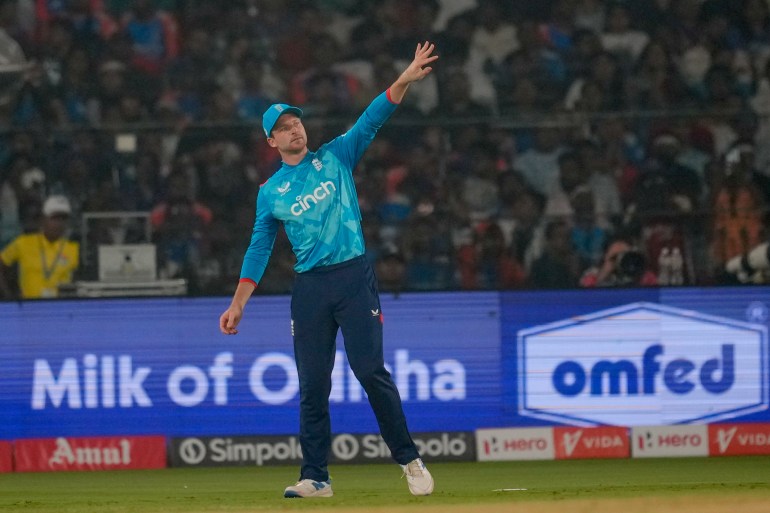 England's captain Jos Buttler adjusts fielding during the second one day international cricket match between India and England in Cuttack, India, Sunday, Feb. 9, 2025. (AP Photo/Rafiq Maqbool)