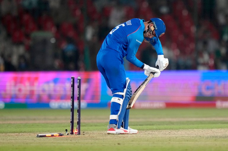 Afghanistan's Noor Ahmad reacts after his dismissal during the ICC Champions Trophy cricket match between Afghanistan and South Africa, in Karachi, Pakistan Friday, Feb. 21, 2025. (AP Photo/Anjum Naveed)