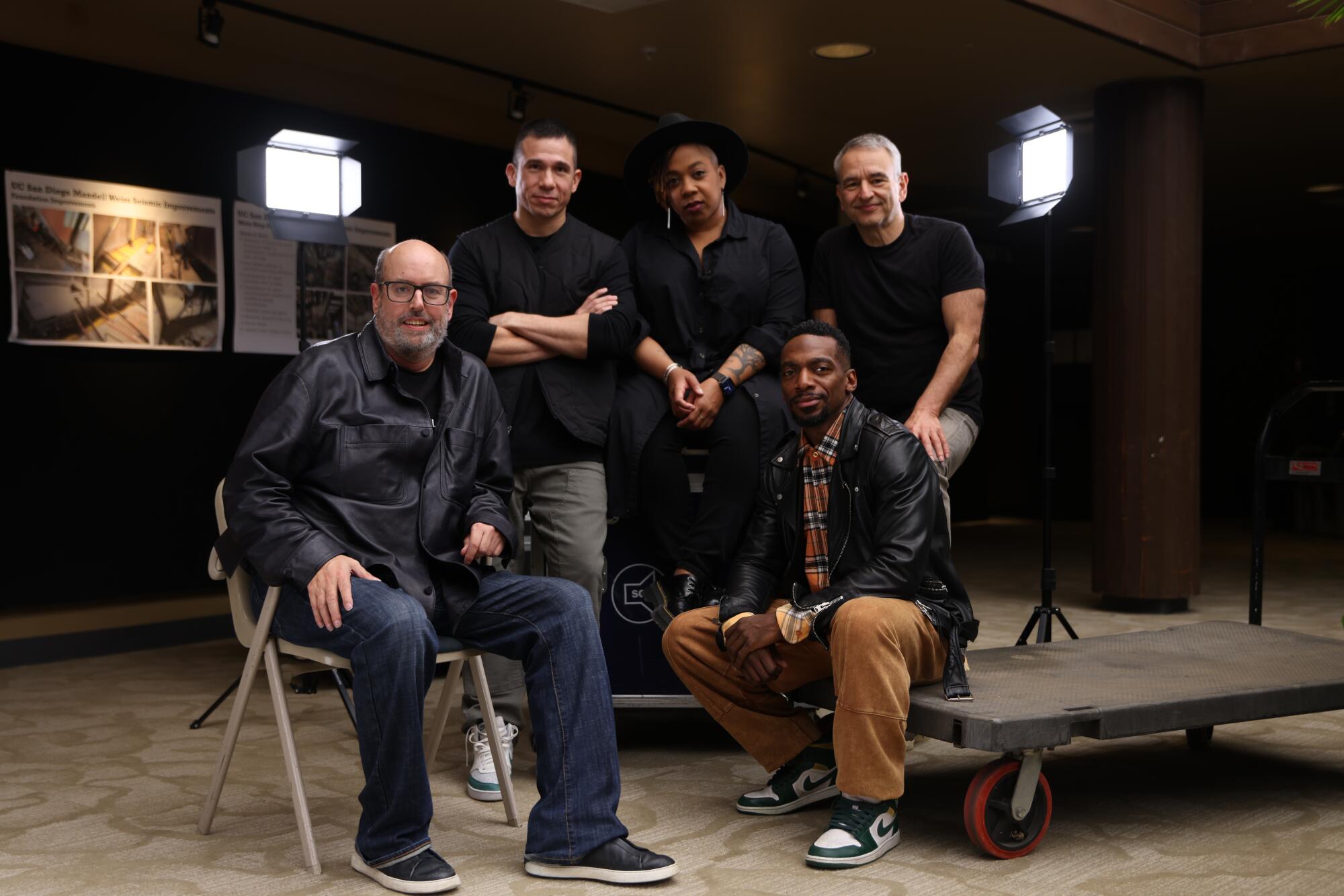 A group of people sitting and standing.