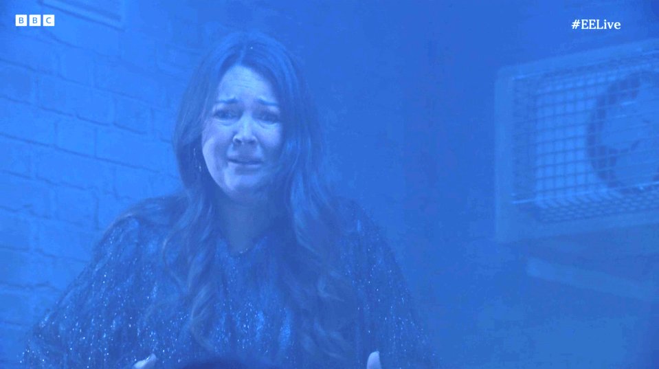 Screenshot of a woman crying.