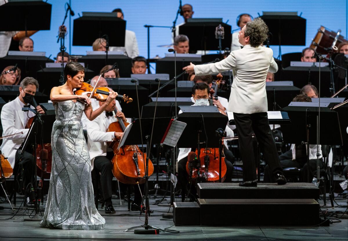 A violinist performs with the L.A. Phil conducted by Gustavo Dudamel.