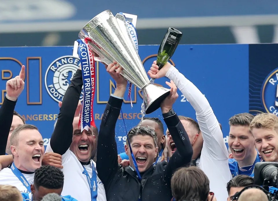 Rangers manager and players celebrating a championship win.