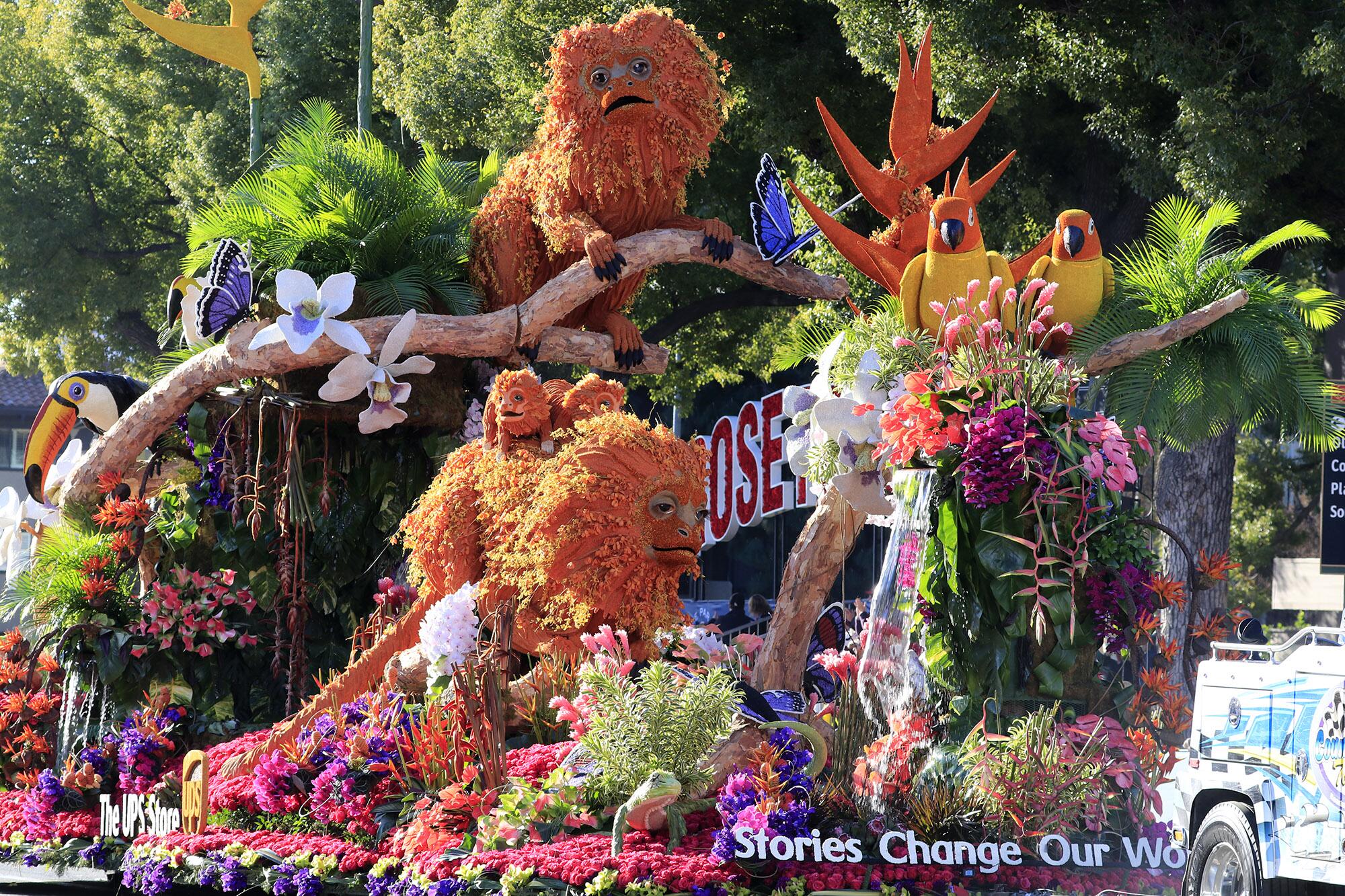 A float reads “Stories Change Our World” in the Rose Parade.