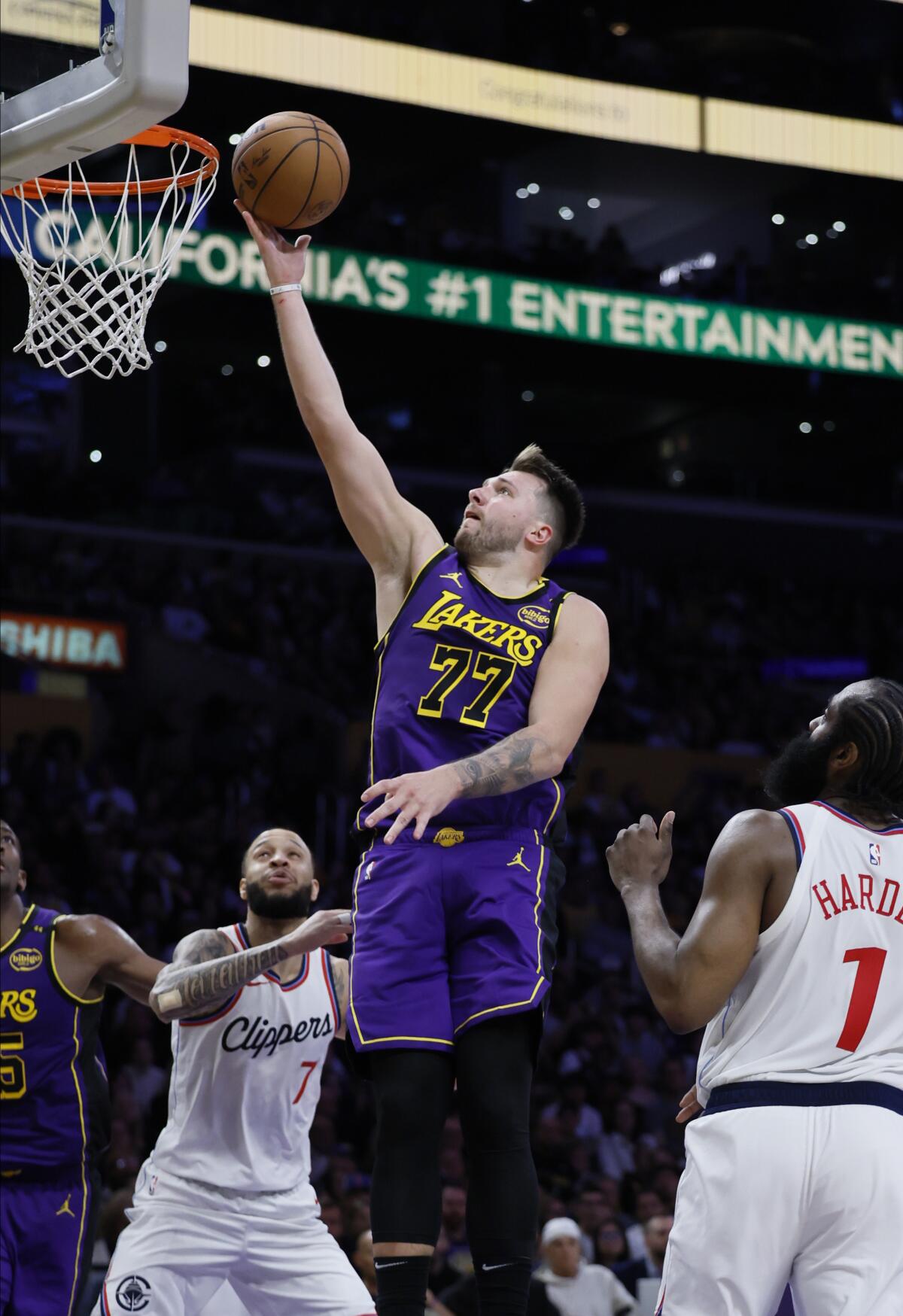 Lakers guard Luka Doncic scores in the lane during the second half Friday night in the win over the Clippers.