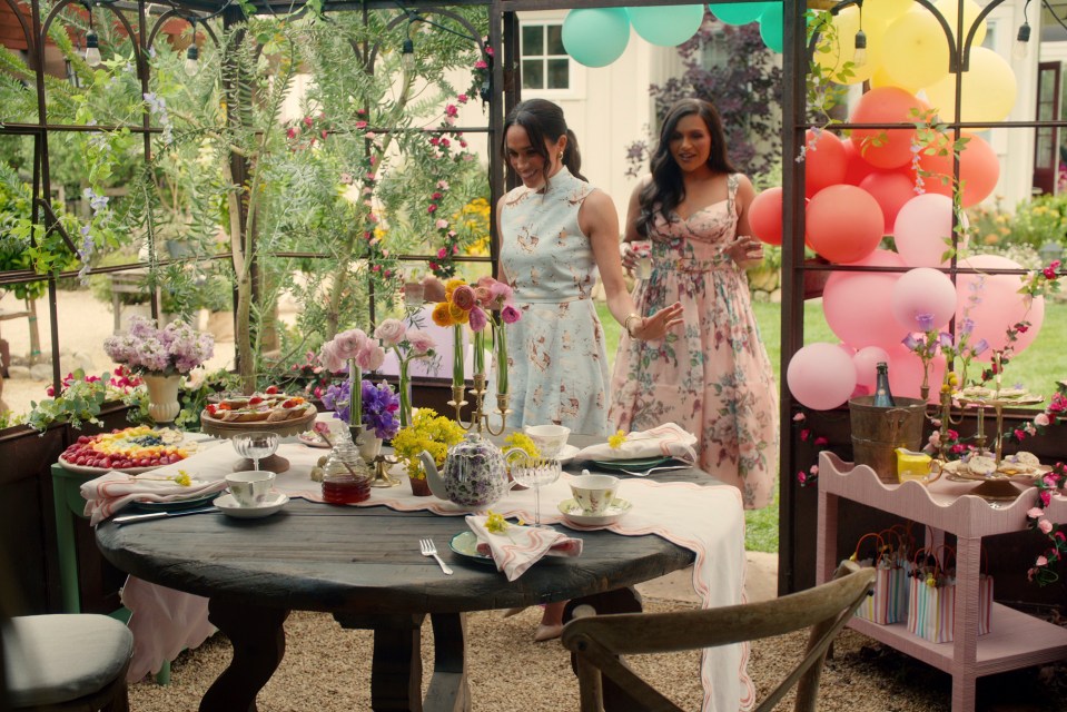 Meghan Markle and Mindy Kaling at a garden party.