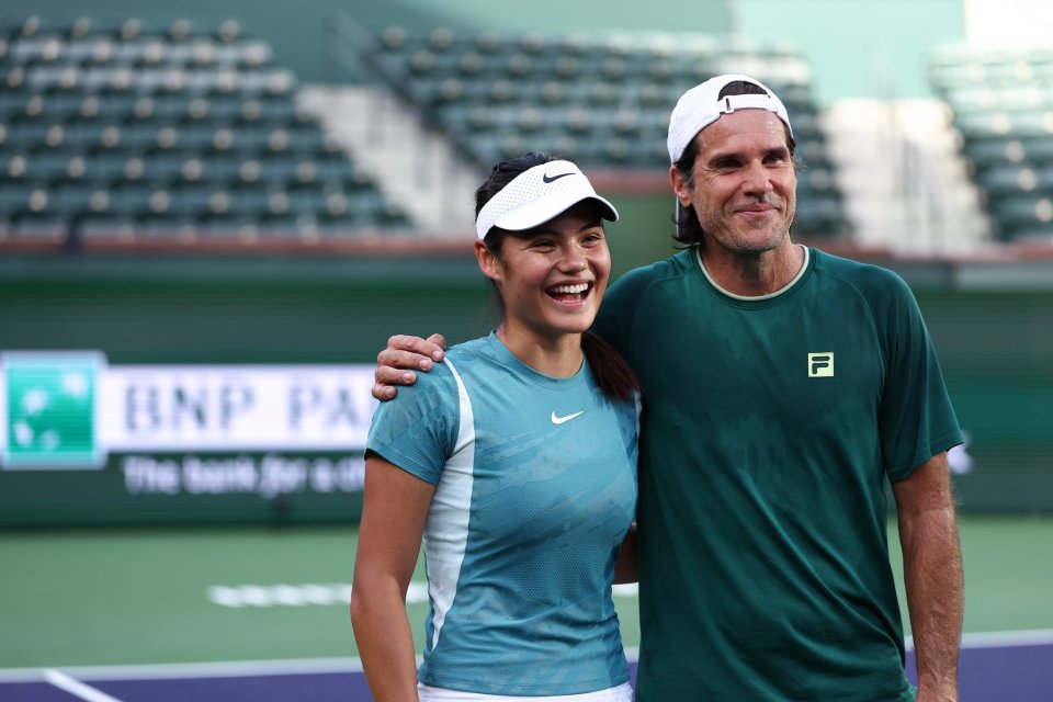 Emma Raducanu and her coach on a tennis court.