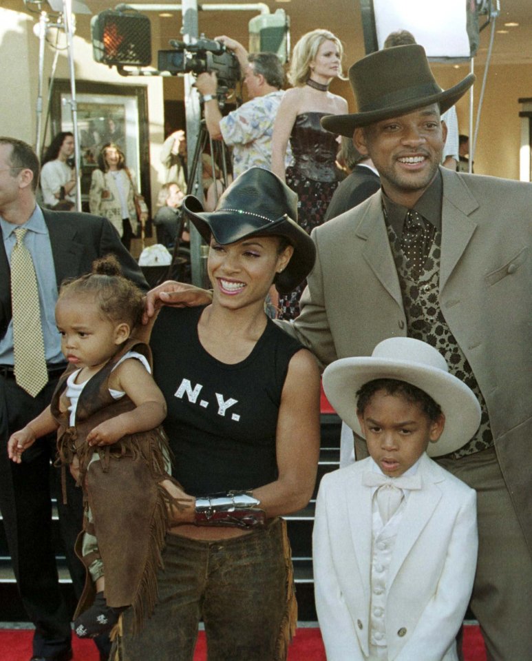 Will Smith, Jada Pinkett Smith, and their sons Trey and Jaden at a film premiere.