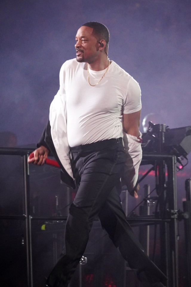 Will Smith performing onstage.