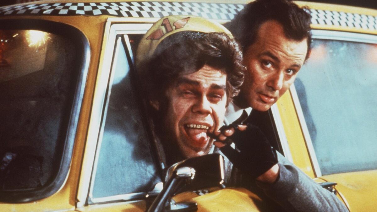 Still of Bill Murray and David Johansen in "Scrooged" 1988.