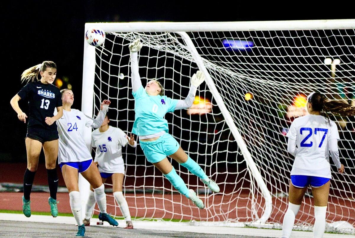 Santa Margarita goalkeeper Kayla Burmood blocks a header by Santiago’s Gabi Germain (13) in the second half.