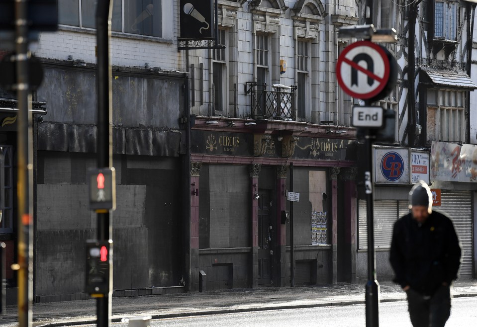 Boarded-up shops and a closed pub in Bolton town centre.