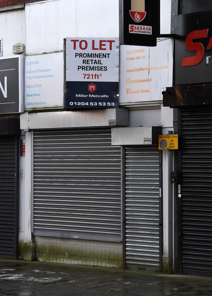 Closed shop fronts in Bolton town centre.