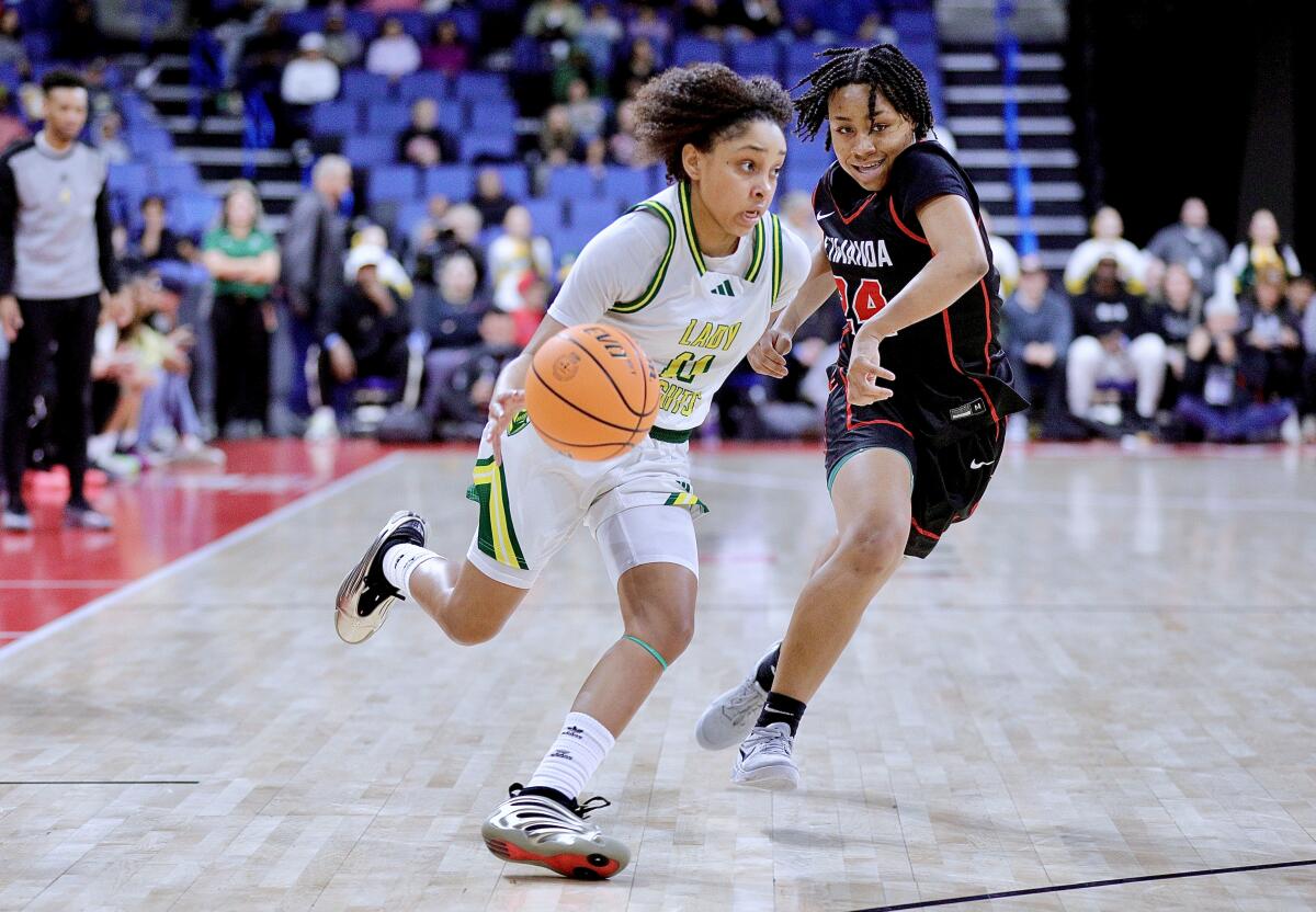 Ontario Christian's Kaleena Smith, left, drives past Etiwanda's Chasity Rice.