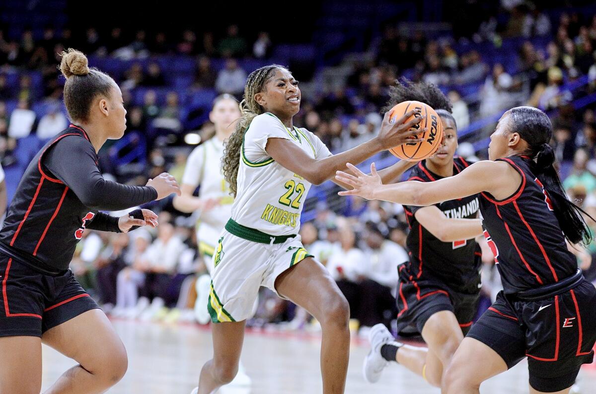 Ontario Christian's Alanna Neale drives between the Etiwanda defense.