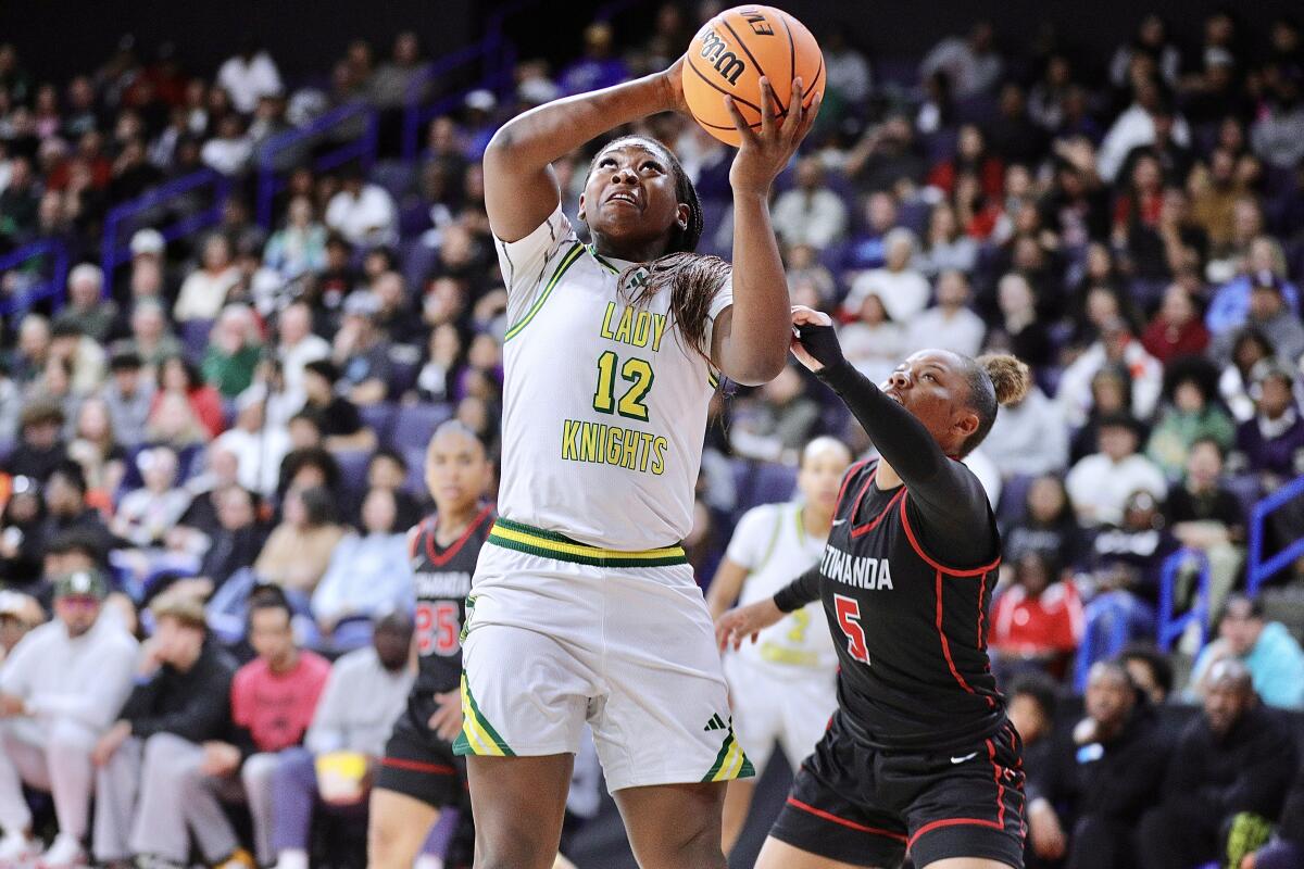 Ontario Christian's Tatianna Griffin puts up a shot in front of Etiwanda's Shaena Brew.