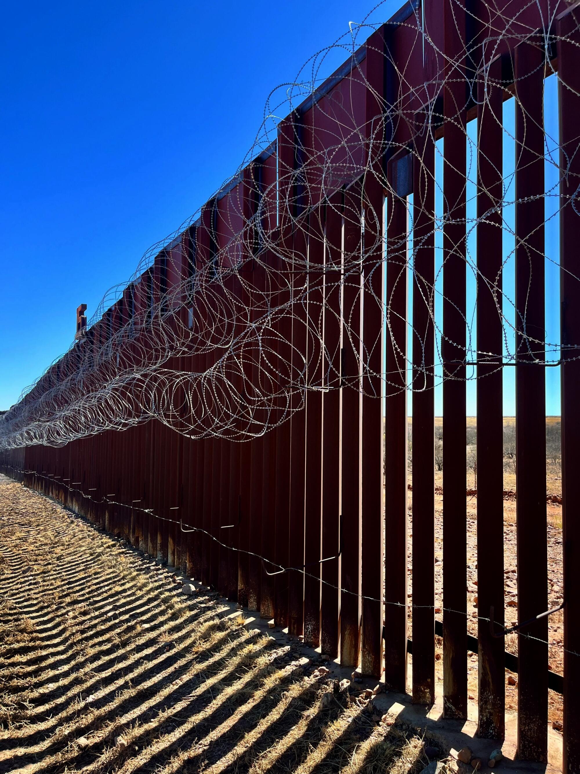 The border wall runs the southern length of John Ladd's ranch.