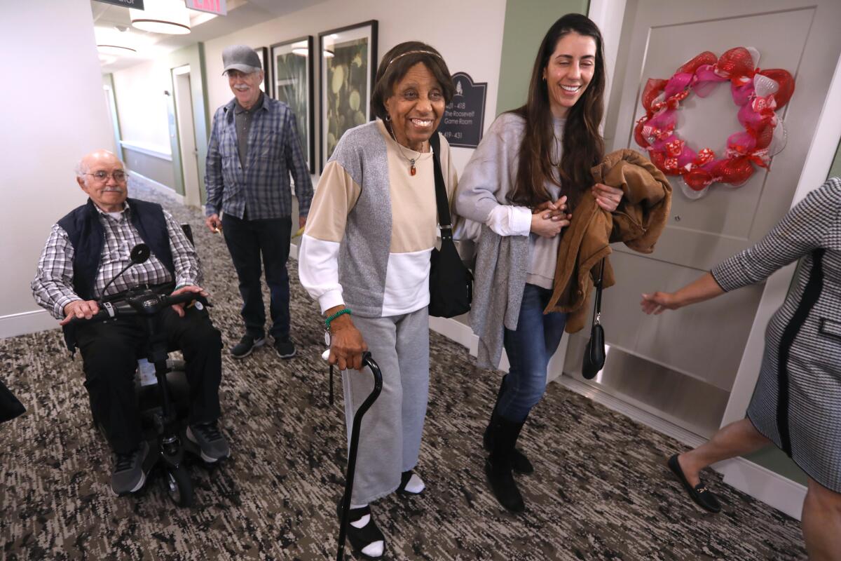 Pacific Palisades resident Louvenia Jenkins, 96, center, and her caregiver and friend Josemara Lima, right.