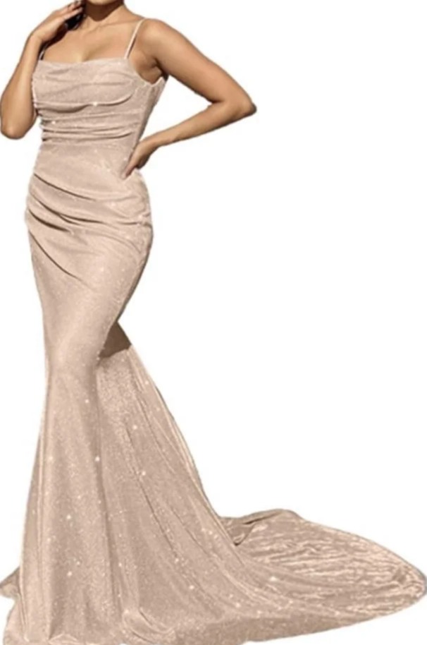 Woman in a sparkly, champagne-colored, mermaid-style gown.