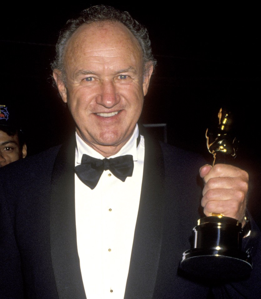 Gene Hackman holding an Academy Award.