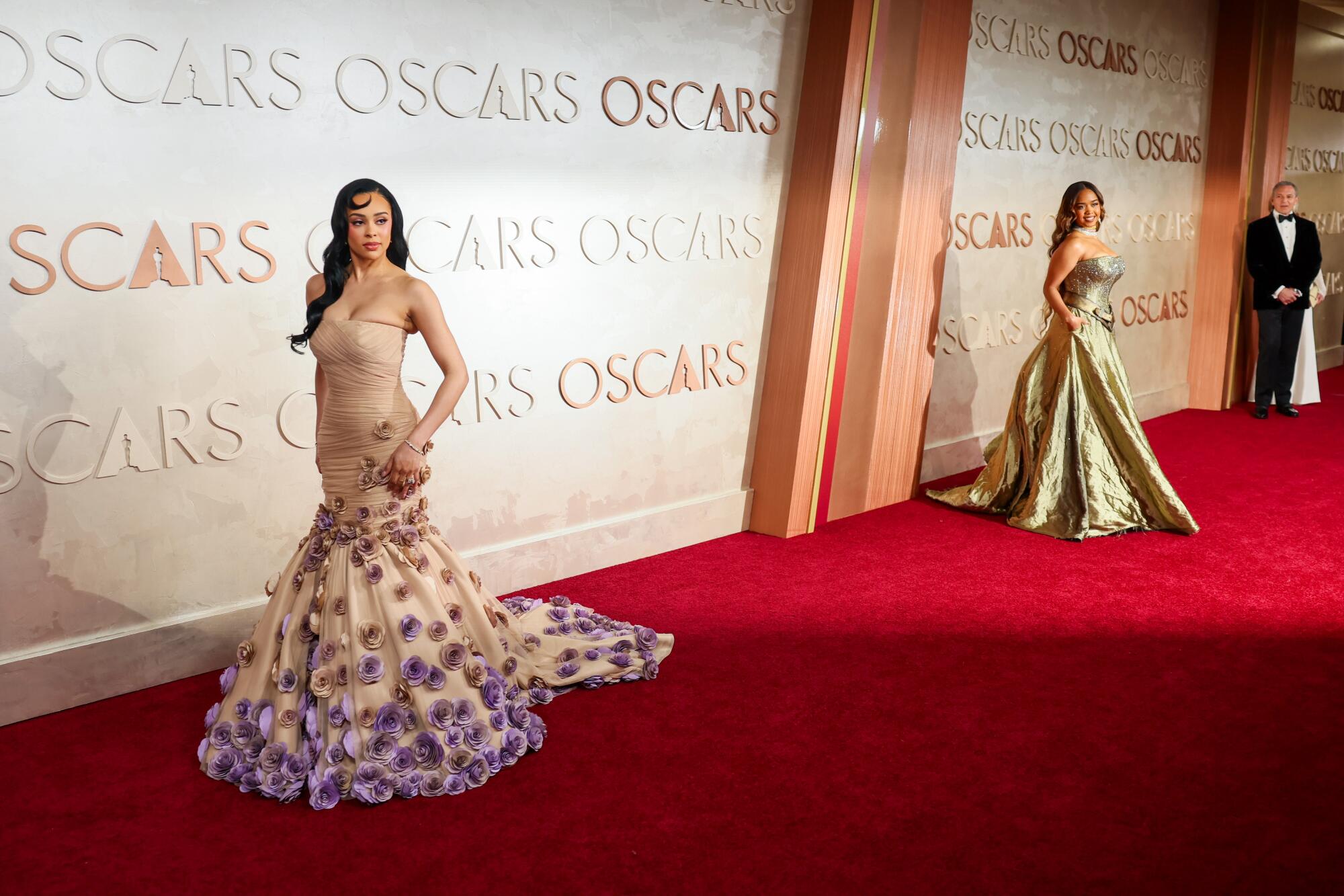 Two women in gowns.