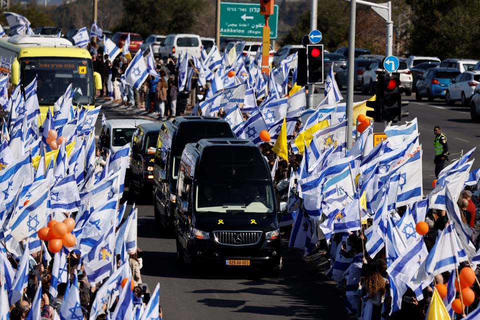 Funeral procession with Israeli flags.