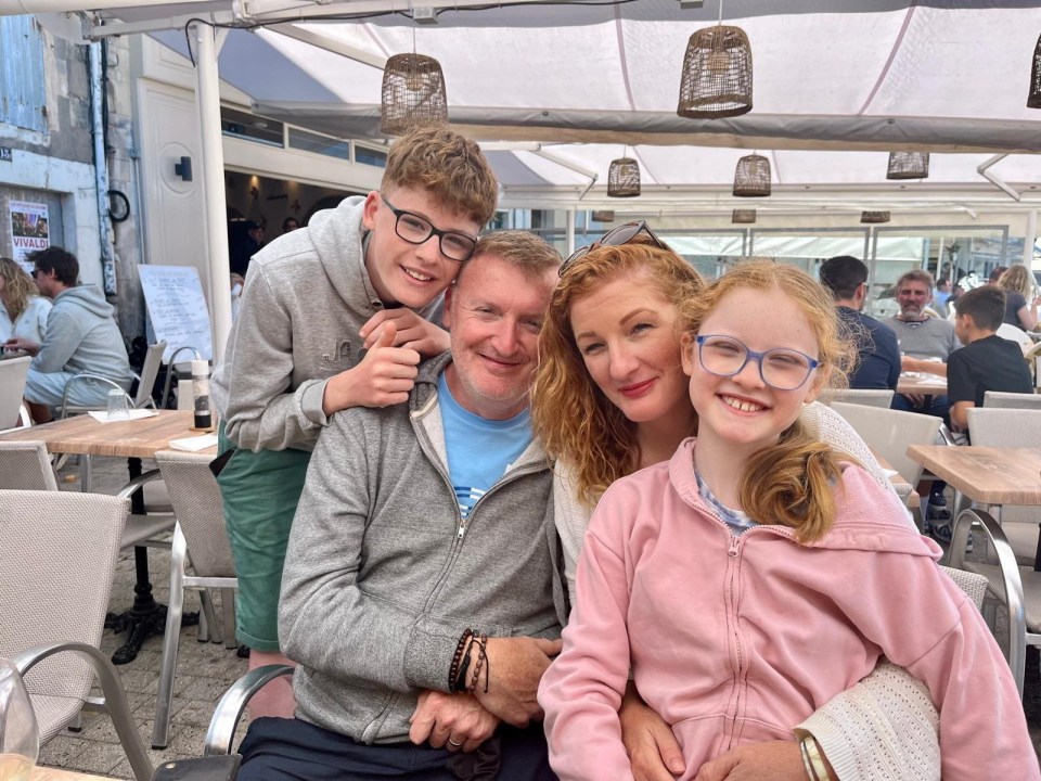 Family portrait at an outdoor cafe.