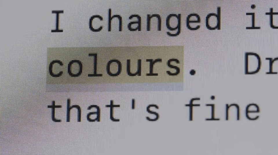 Close-up of a computer screen displaying text that includes the word "colours" highlighted in a light beige box.