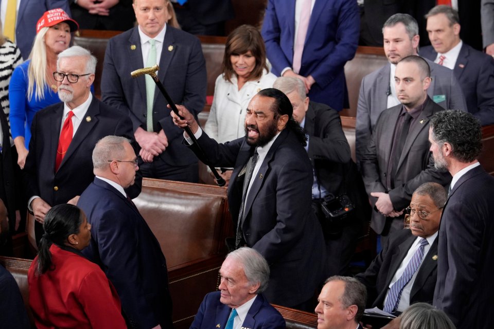 Rep. Al Green disrupting a Trump speech and being escorted out.