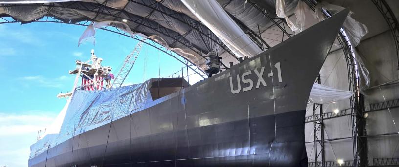 USX-1, the world's first full-size drone warship, in a hangar.