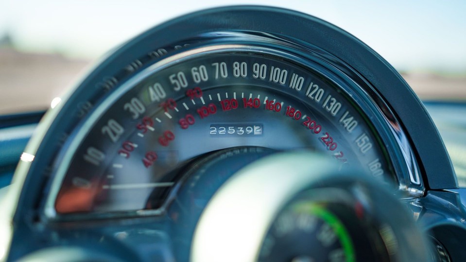 Close-up of a 1960 Chevrolet Corvette speedometer showing 225392 miles.