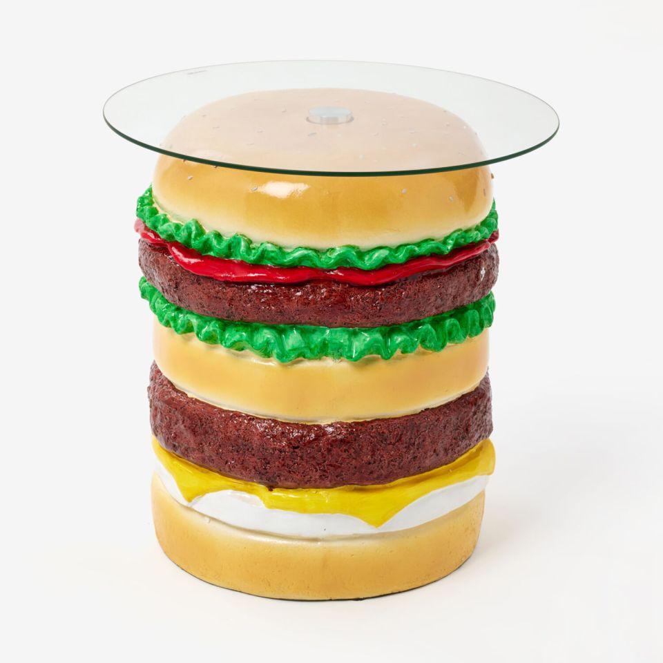 Burger-shaped side table with glass top.