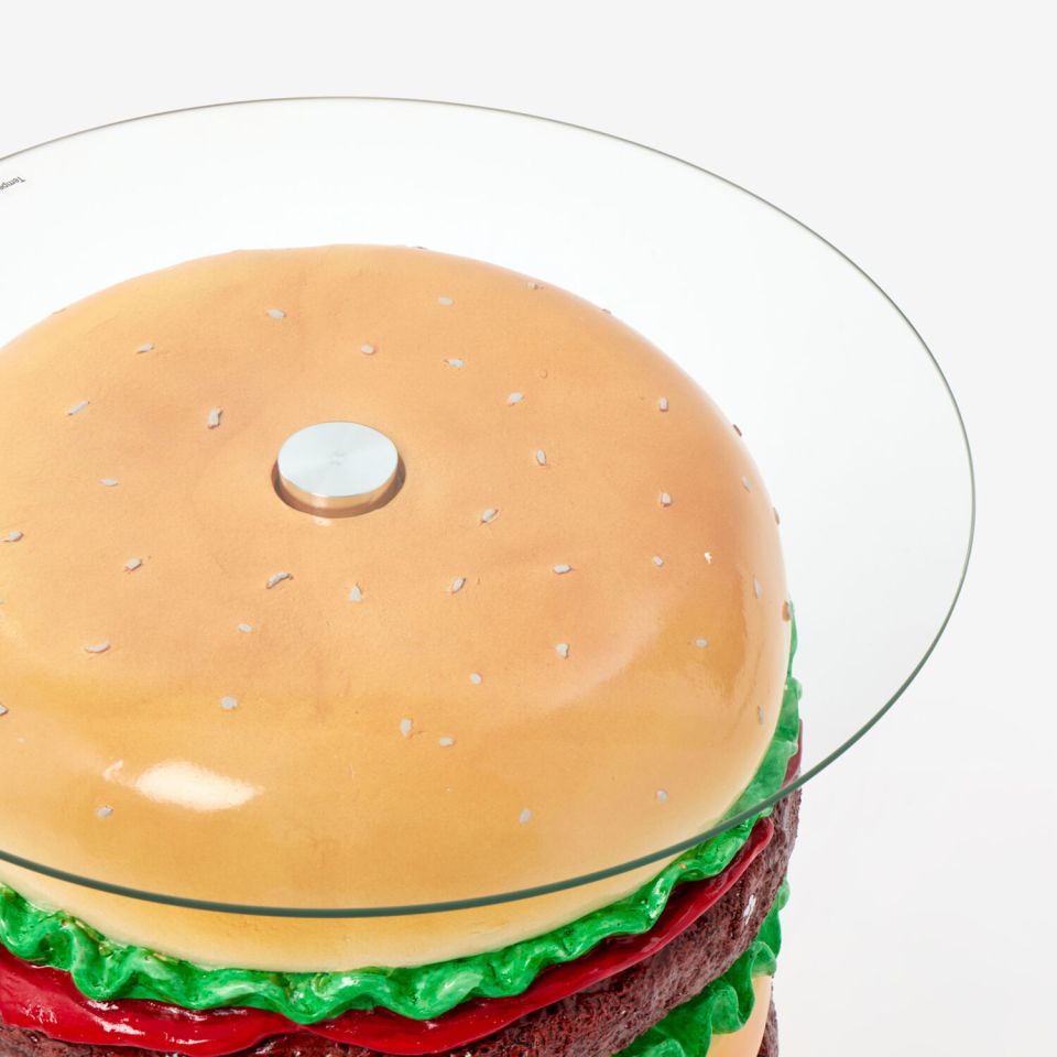 Burger-shaped side table with glass top.