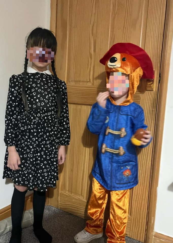 Two children dressed for World Book Day; one in a black and white dress, the other in a Paddington Bear costume.